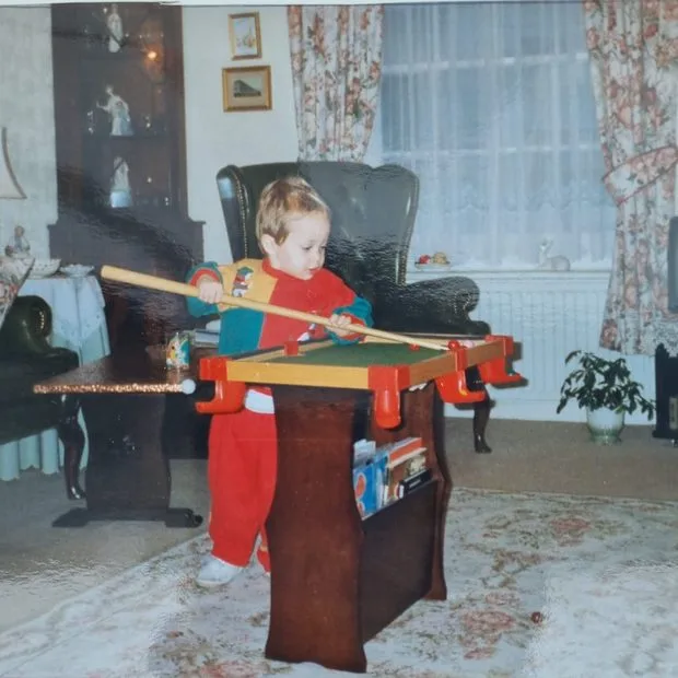 One of the MyBreak team as a kid, already on the table