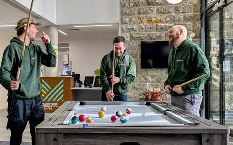 The MyBreak team sharing a frame of pool